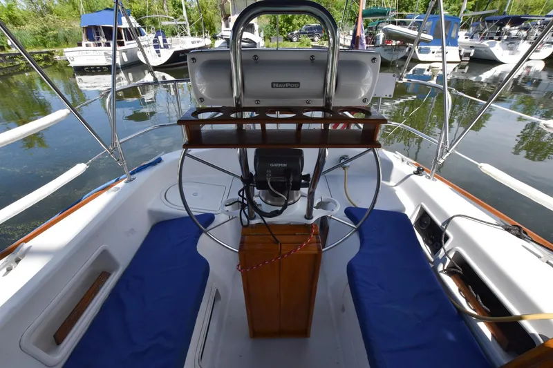 Slide: The Image of Cockpit of a 1985 Pearson 36-2 sailboat docked at a marina. - 9