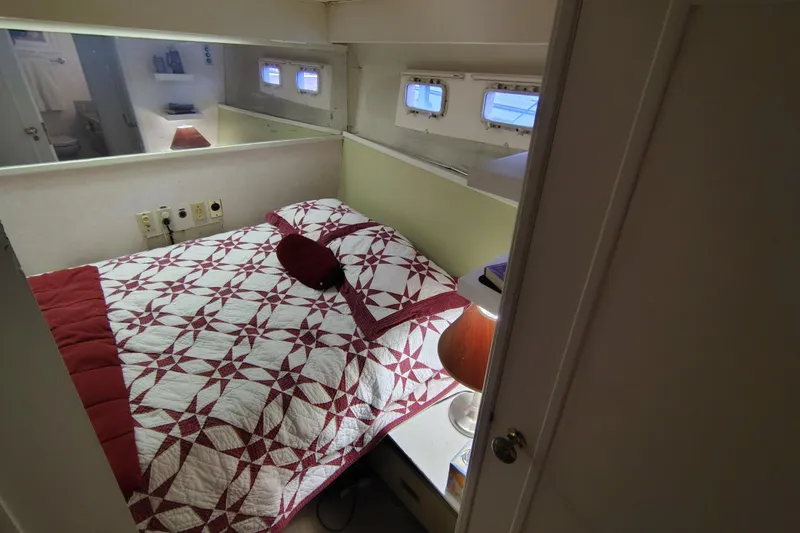 Slide: The Image of Cozy bedroom in 1976 Bertram 58 Flybridge Motor Yacht with quilted bedspread. - 19