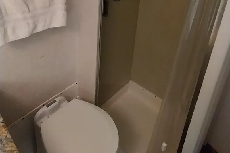 Slide: The Image of Bathroom in 1976 Bertram 58 Flybridge Motor Yacht with toilet and shower. - 25