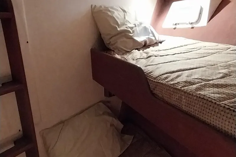 Slide: The Image of Cozy cabin bed in a 1976 Bertram 58 Flybridge Motor Yacht. - 28