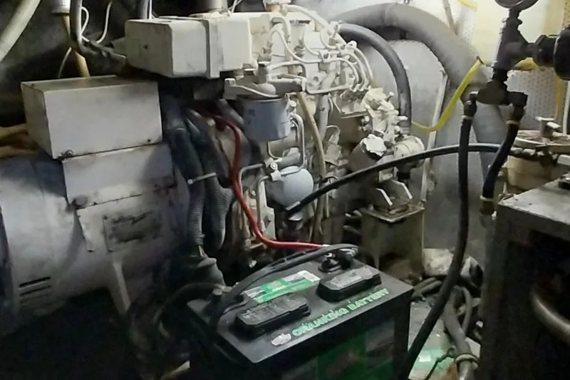 Slide: The Image of Engine room of a 1976 Bertram 58 Flybridge Motor Yacht with battery and wiring. - 38