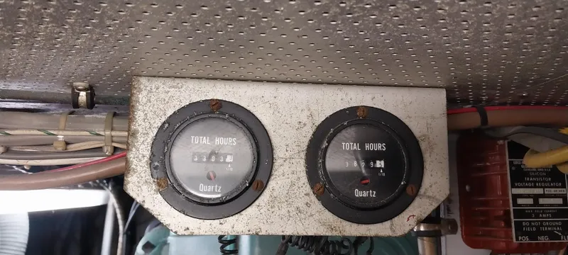 Slide: The Image of Hour meters on a 1976 Bertram 58 Flybridge Motor Yacht dashboard. - 39