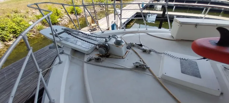 Slide: The Image of 1976 Bertram 58 Flybridge Motor Yacht deck with railing and equipment. - 53