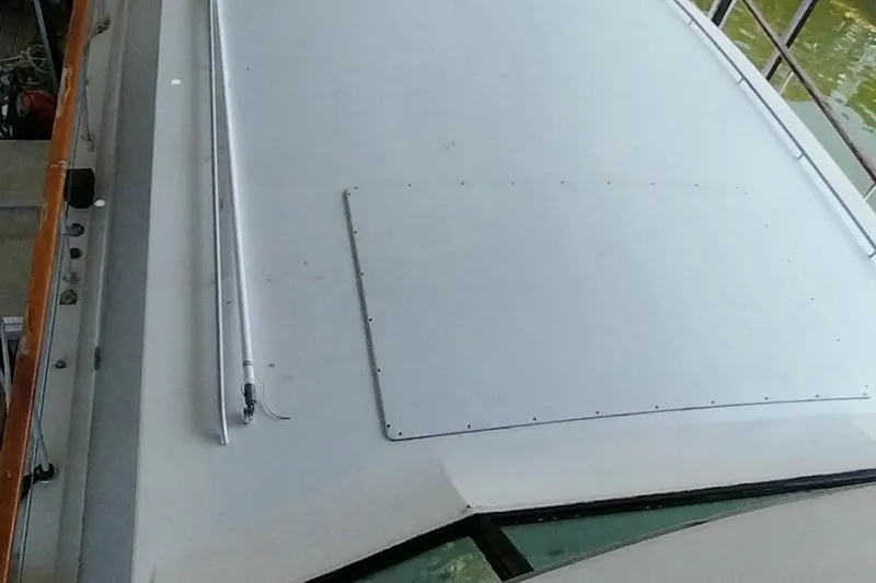 Slide: The Image of 1976 Bertram 58 Flybridge Motor Yacht roof detail, showcasing sleek design and craftsmanship. - 56