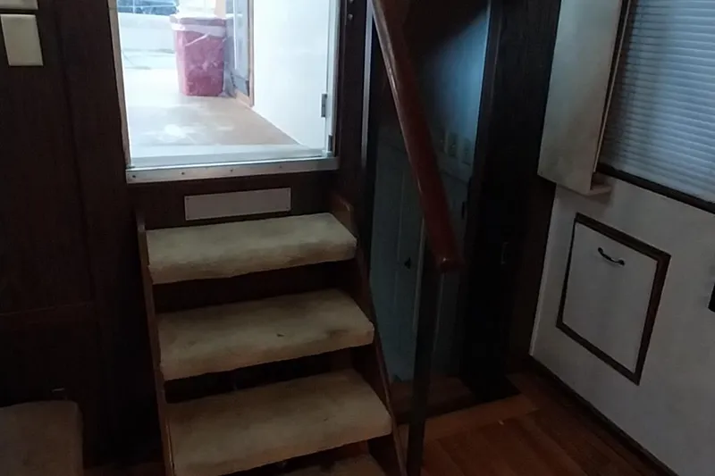 Slide: The Image of Interior stairs of a 1976 Bertram 58 Flybridge Motor Yacht. - 6