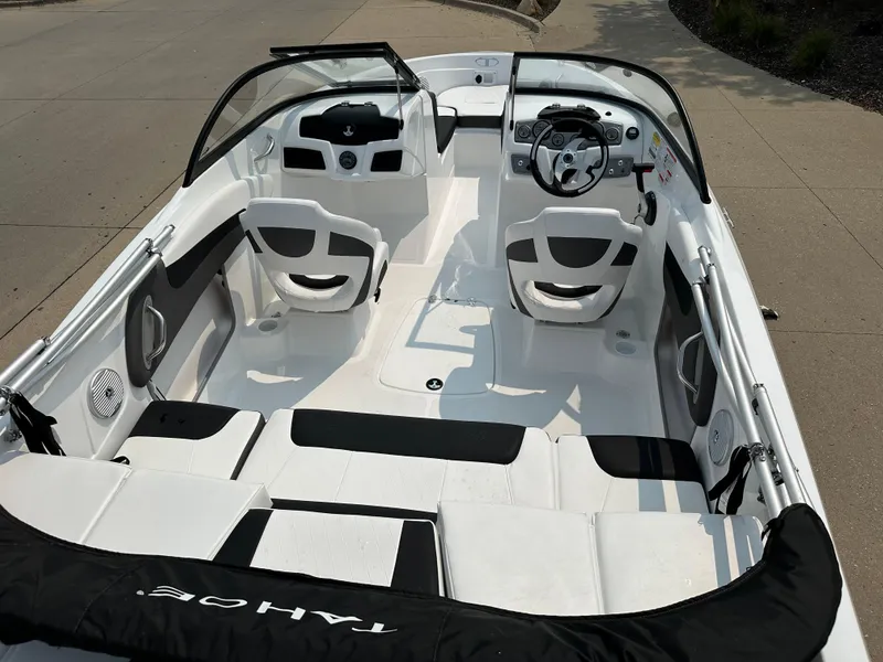 Slide: The Image of 2024 Tahoe 200 S boat interior with white and black seating. - 8
