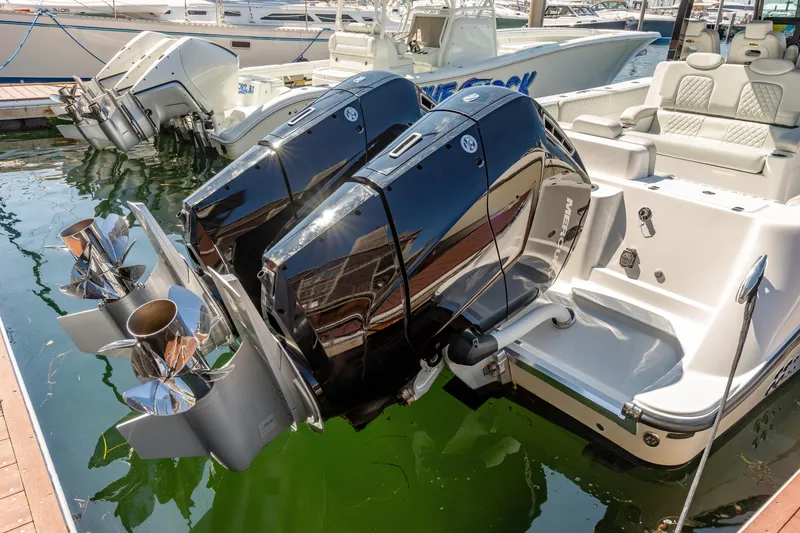 Slide: The Image of 2024 HCB 39 Speciale boat with dual outboard engines docked. - 17