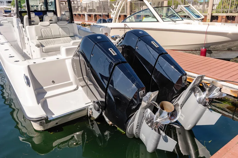 Slide: The Image of 2024 HCB 39 Speciale boat with dual outboard engines docked. - 19
