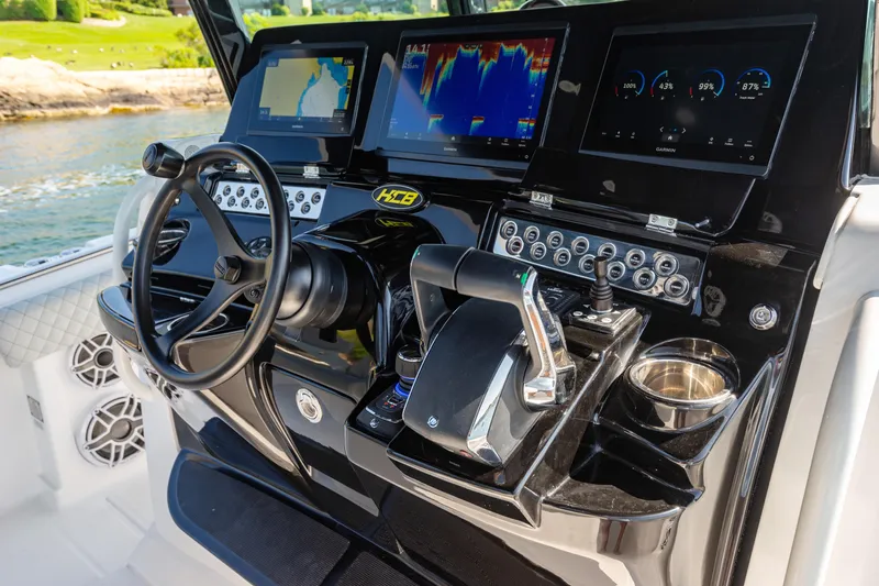 Slide: The Image of 2024 HCB 39 Speciale boat dashboard with advanced navigation and control systems. - 24