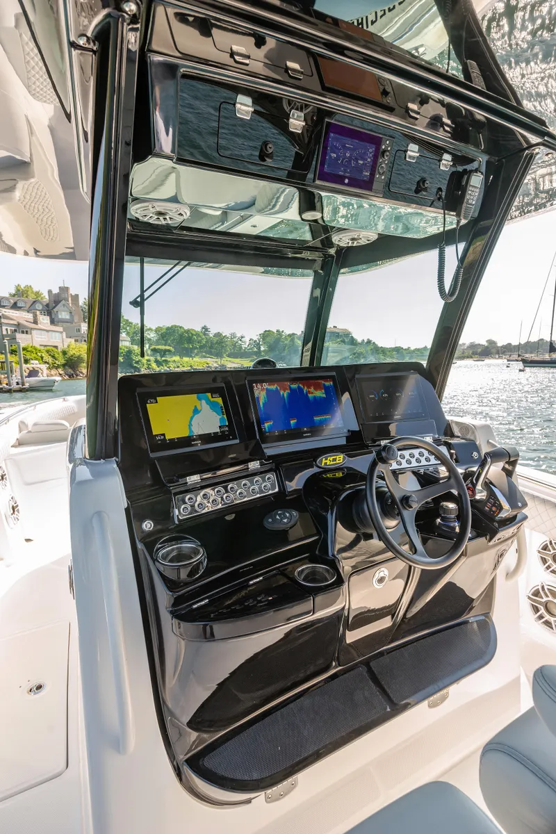 Slide: The Image of 2024 HCB 39 Speciale boat dashboard with advanced navigation systems. - 25
