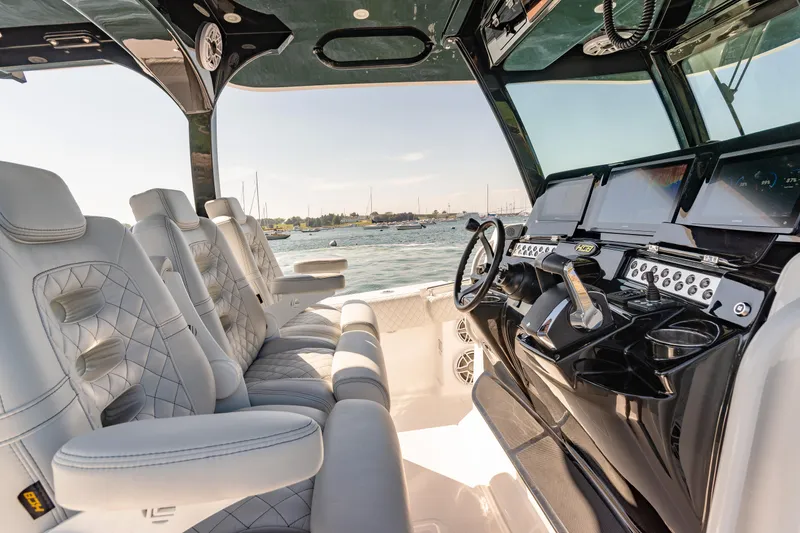 Slide: The Image of Interior of 2024 HCB 39 Speciale boat with luxurious seating and advanced navigation system. - 3