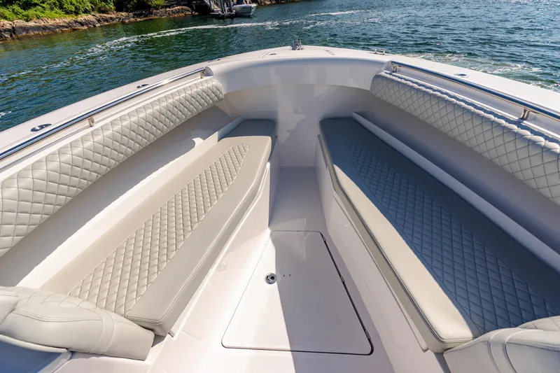 Slide: The Image of 2024 HCB 39 Speciale boat with luxurious seating and scenic water view. - 31