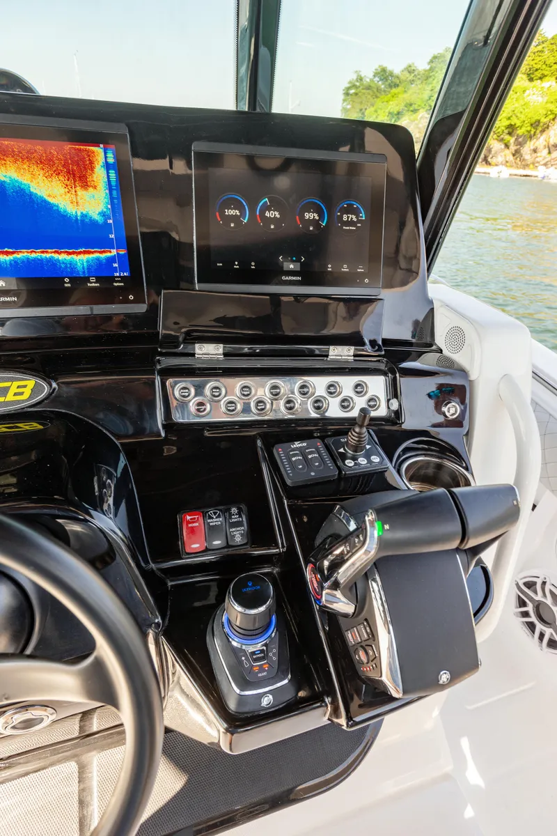 Slide: The Image of 2024 HCB 39 Speciale boat dashboard with advanced navigation and control systems. - 33