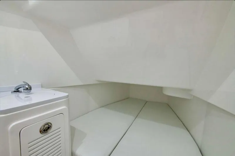 Slide: The Image of 2024 HCB 39 Speciale cabin interior with white cushioned seating and compact sink. - 40