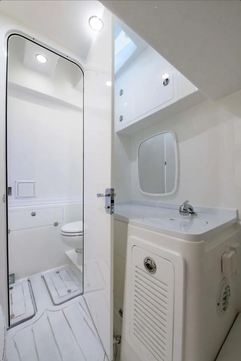 Slide: The Image of 2024 HCB 39 Speciale boat bathroom with modern fixtures and white interior. - 42