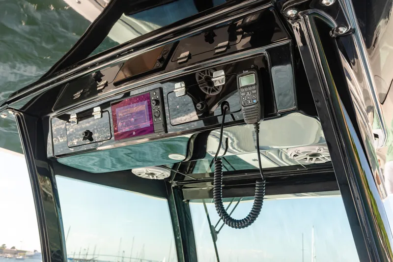 Slide: The Image of 2024 HCB 39 Speciale boat console with navigation and communication equipment. - 6