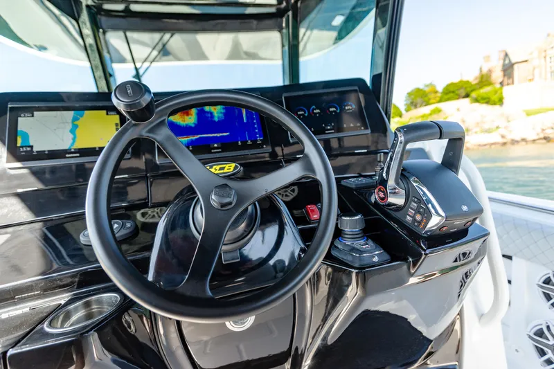 Slide: The Image of 2024 HCB 39 Speciale boat helm with advanced navigation and control systems. - 8