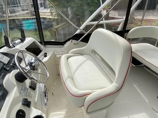 Slide: The Image of Stairs on a 2007 Silverton 33 Convertible boat with stainless steel handrail. - 10