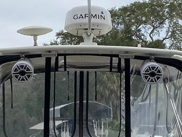 Slide: The Image of Interior of 2007 Silverton 33 Convertible yacht with window blinds and beige seating. - 15