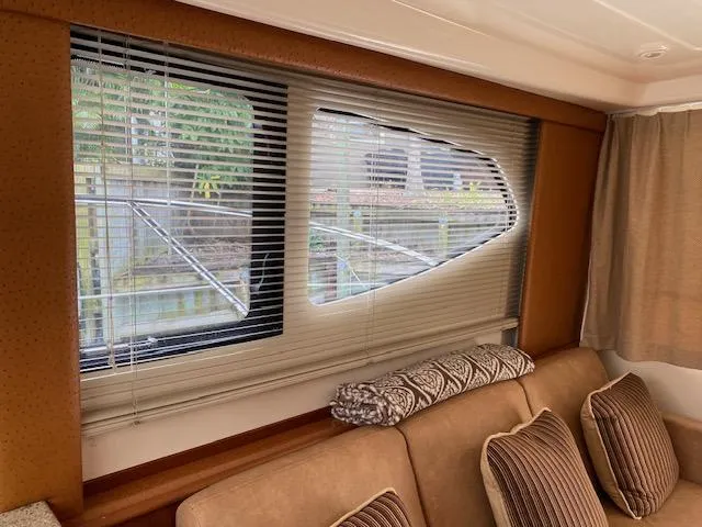 Slide: The Image of Battery compartment of a 2007 Silverton 33 Convertible boat with wiring and 30 AMP breaker. - 18