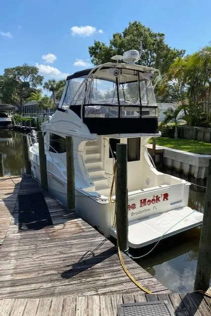 Slide: The Image of 2007 Silverton 33 Convertible boat docked in Bradenton, FL. - 2