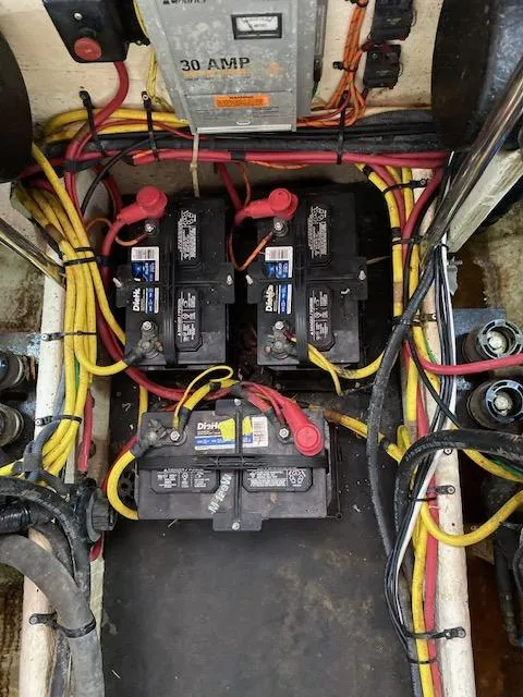 Slide: The Image of Engine compartment of a 2007 Silverton 33 Convertible boat with visible blue engine components. - 21