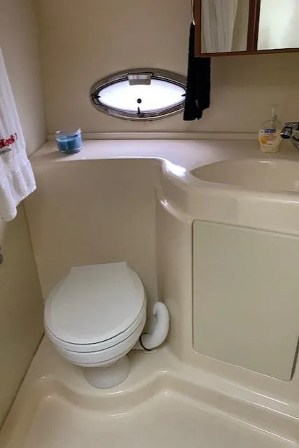 Slide: The Image of Interior cabin of a 2007 Silverton 33 Convertible boat with a dark mattress. - 34