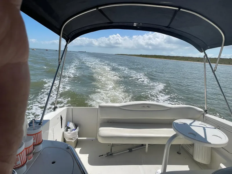 Slide: The Image of 2006 Sea Ray 280 Sundancer cruising on open water under a clear sky. - 10