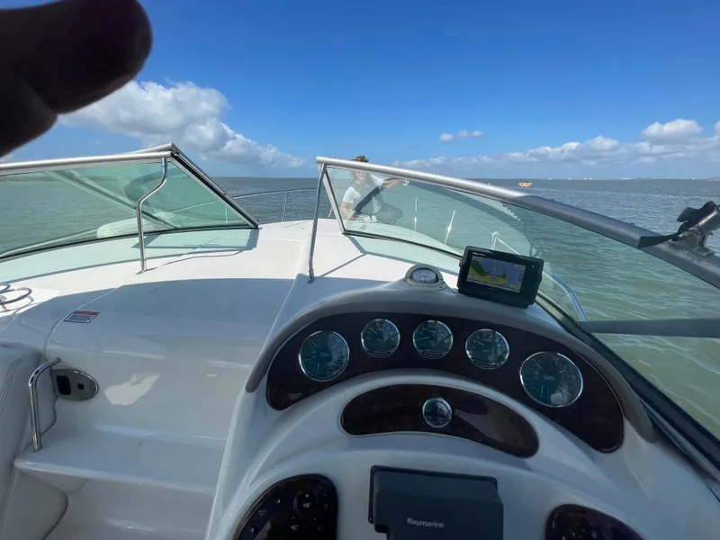 Slide: The Image of 2006 Sea Ray 280 Sundancer boat dashboard with ocean view. - 11