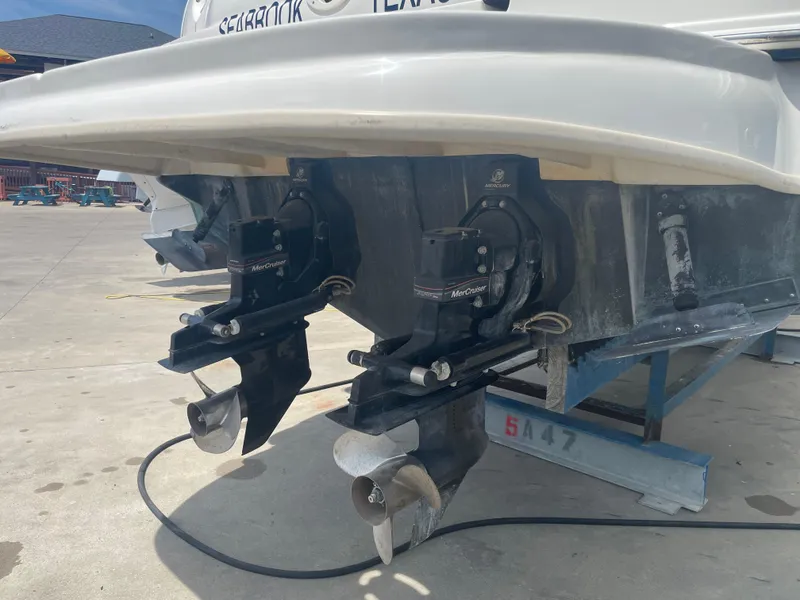 Slide: The Image of 2006 Sea Ray 280 Sundancer boat with dual propellers on a trailer. - 15