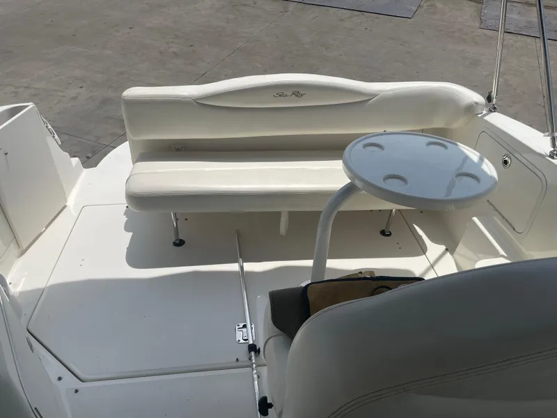 Slide: The Image of 2006 Sea Ray 280 Sundancer boat interior with seating and table. - 20