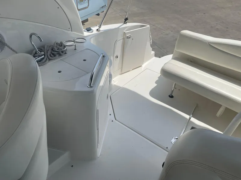 Slide: The Image of Interior view of 2006 Sea Ray 280 Sundancer boat with seating and storage. - 21
