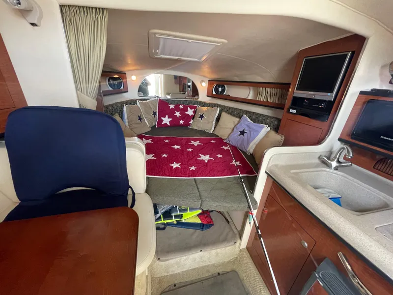 Slide: The Image of Interior of 2006 Sea Ray 280 Sundancer with cozy seating and modern amenities. - 29