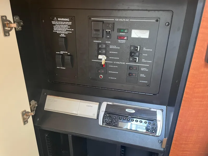 Slide: The Image of Electrical control panel on a 2006 Sea Ray 280 Sundancer boat. - 33