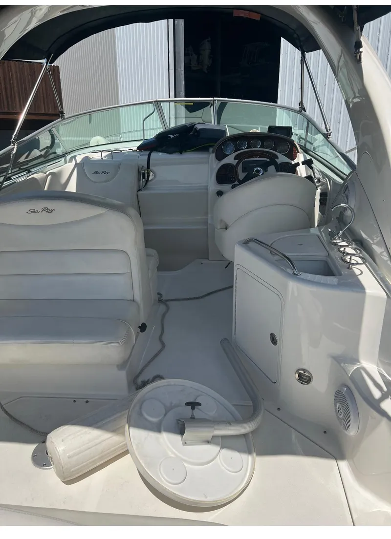 Slide: The Image of 2006 Sea Ray 280 Sundancer boat interior with seating and control panel. - 5