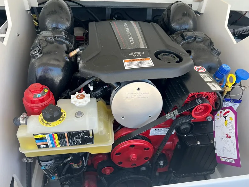 Slide: The Image of 2025 Crownline 220 SS boat engine compartment with detailed components. - 7