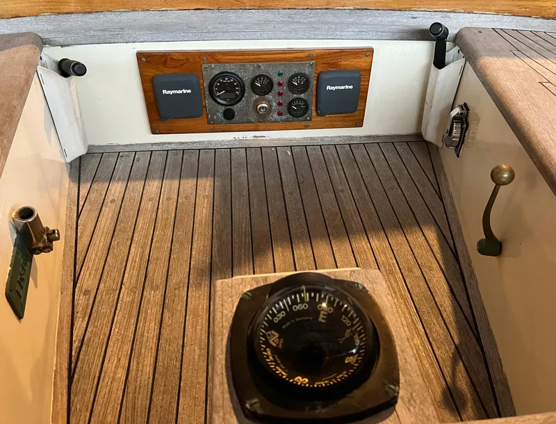 Slide: The Image of Cockpit of 1999 Custom Lyle Hess Cutter with compass and navigation instruments. - 18