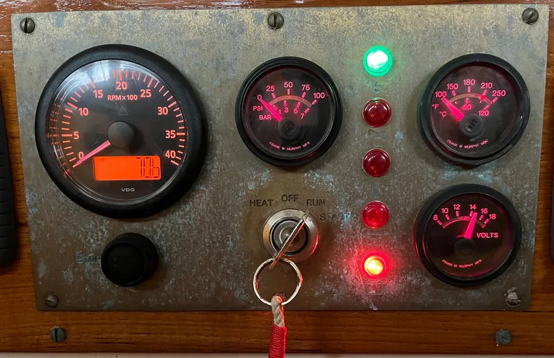 Slide: The Image of Control panel of a 1999 Custom Lyle Hess Cutter with gauges and indicator lights. - 20