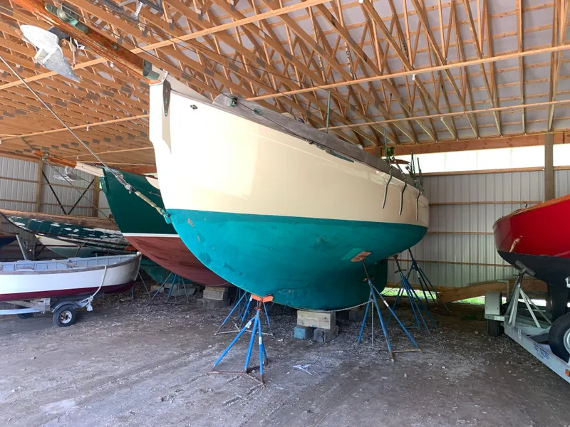 Slide: The Image of Sailboat in storage, Custom Lyle Hess Cutter, 1999, under wooden roof. - 27