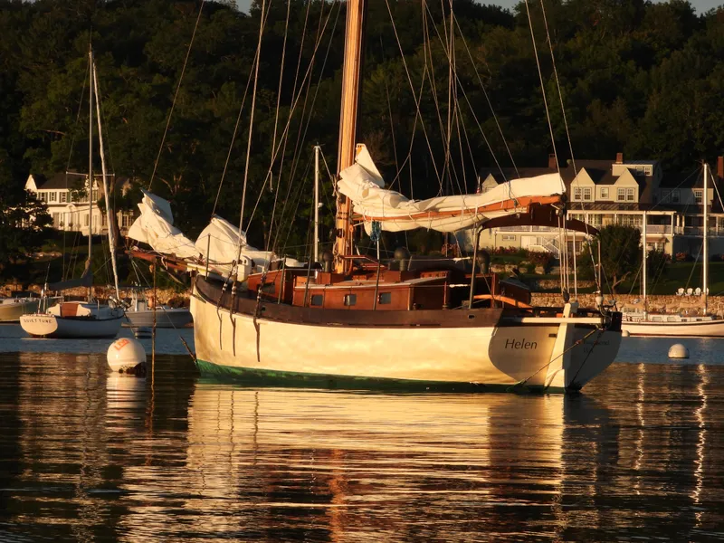 Slide: The Image of Sailboat "Helen" on calm water, Custom Lyle Hess Cutter, 1999, with scenic shoreline backdrop. - 9