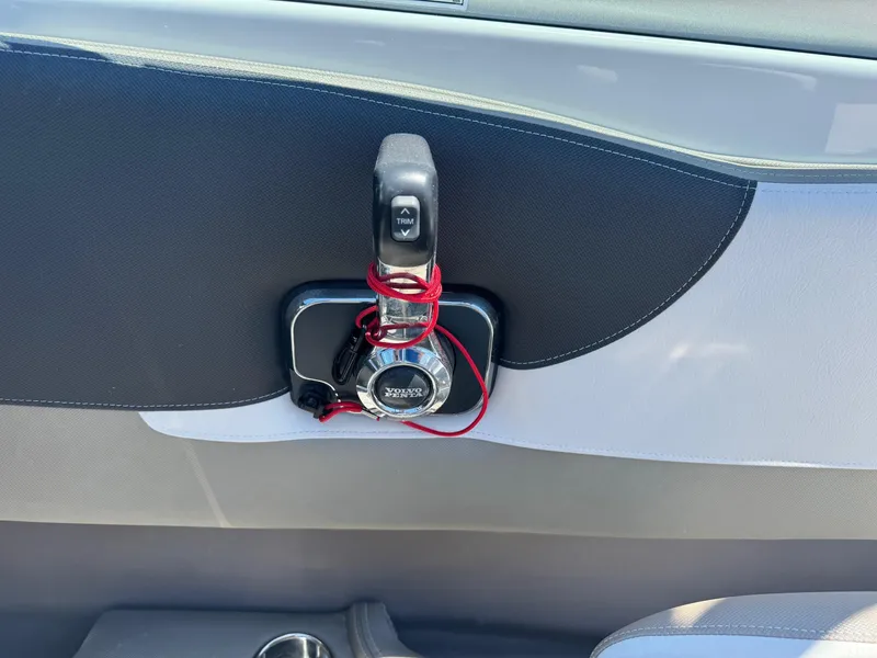 Slide: The Image of 2025 Crownline 240 SS engine compartment with battery and wiring. - 13