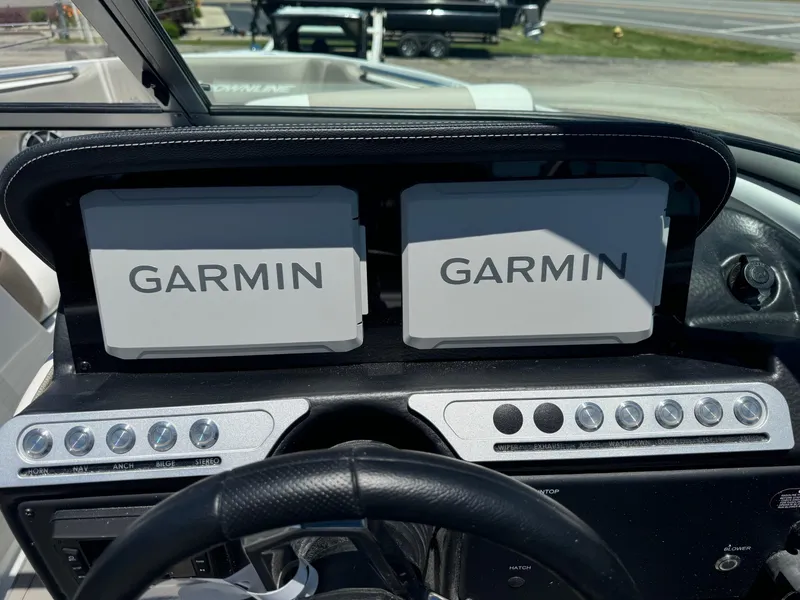 Slide: The Image of 2025 Crownline 240 SS boat interior with cushioned seating and storage compartments. - 14