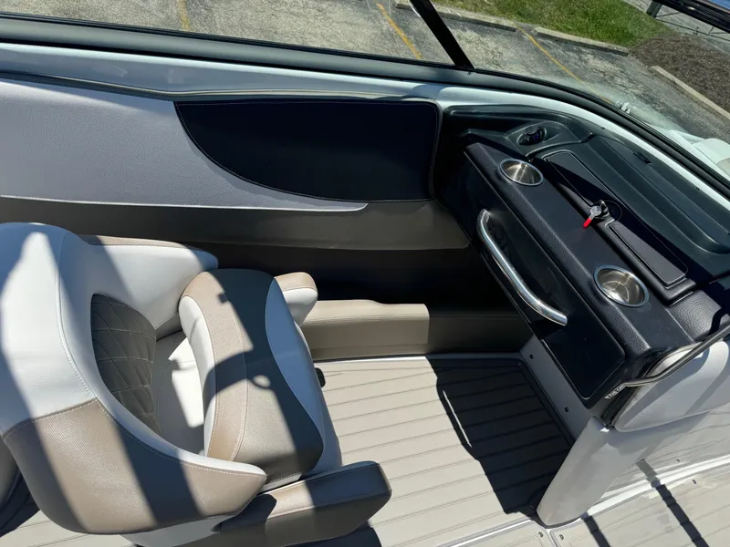 Slide: The Image of 2025 Crownline 240 SS boat interior with seating and deck view. - 15
