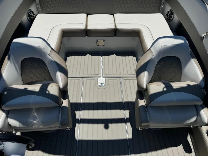 Slide: The Image of 2025 Crownline 240 SS boat interior with adjustable seating and modern design. - 17