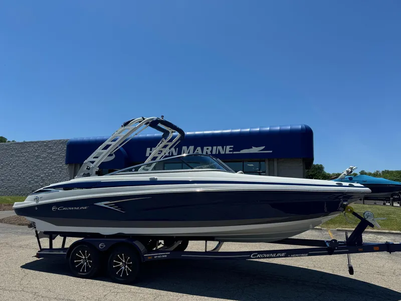 Slide: The Image of Crownline 240 SS 2025 boat ignition switch and throttle control. - 6