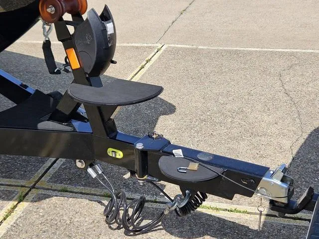 Slide: The Image of Trailer hitch of 2024 Axis Wake Research A225 boat on pavement. - 10