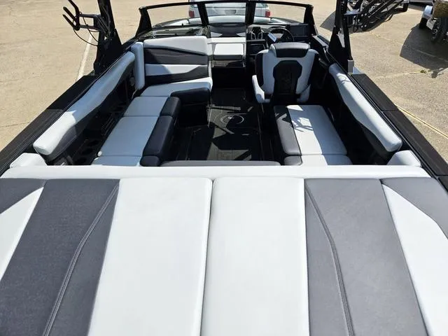 Slide: The Image of 2024 Axis Wake Research A225 boat interior with spacious seating and modern design. - 13