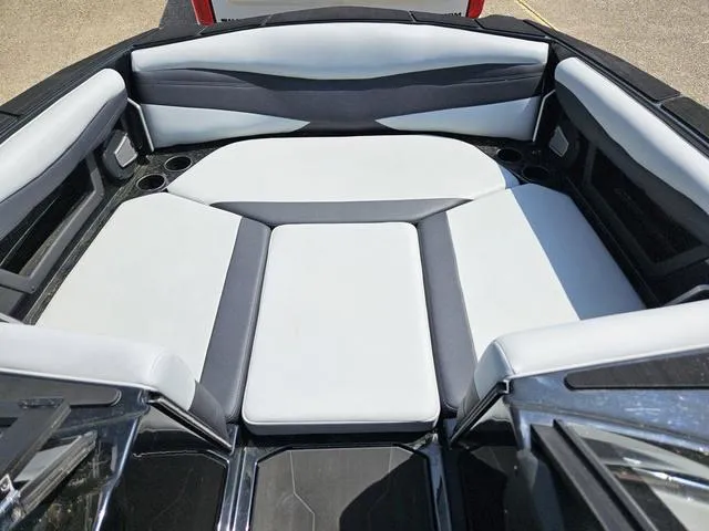 Slide: The Image of 2024 Axis Wake Research A225 boat interior with sleek, modern seating design. - 14