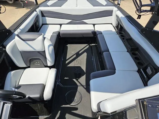 Slide: The Image of 2024 Axis Wake Research A225 boat interior with spacious seating and modern design. - 19