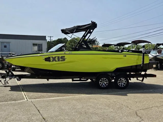 Slide: The Image of 2024 Axis Wake Research A225 boat interior with spacious seating and modern design. - 2